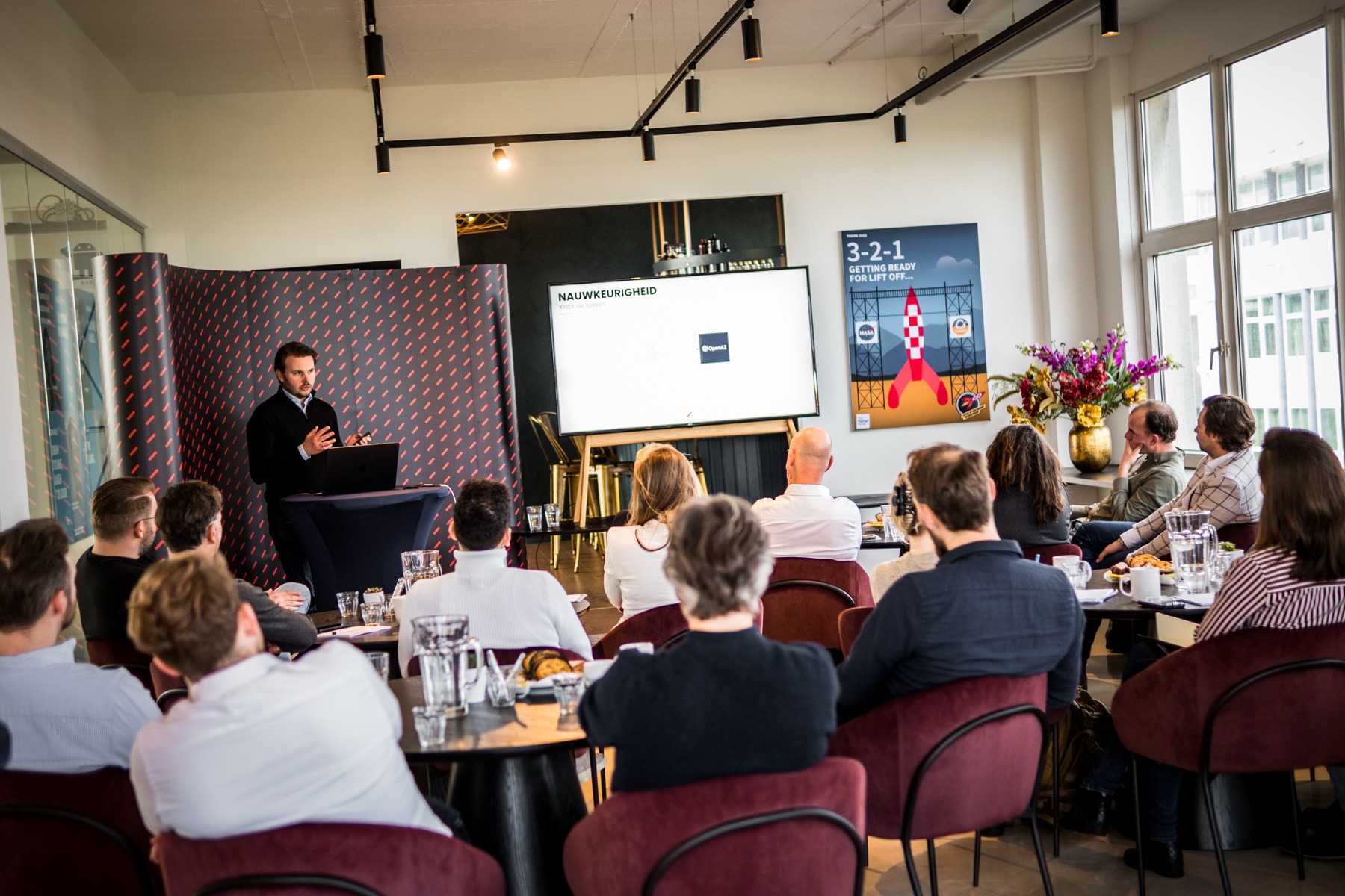 Deelnemers in de zaal tijdens een AIStudio-sessie